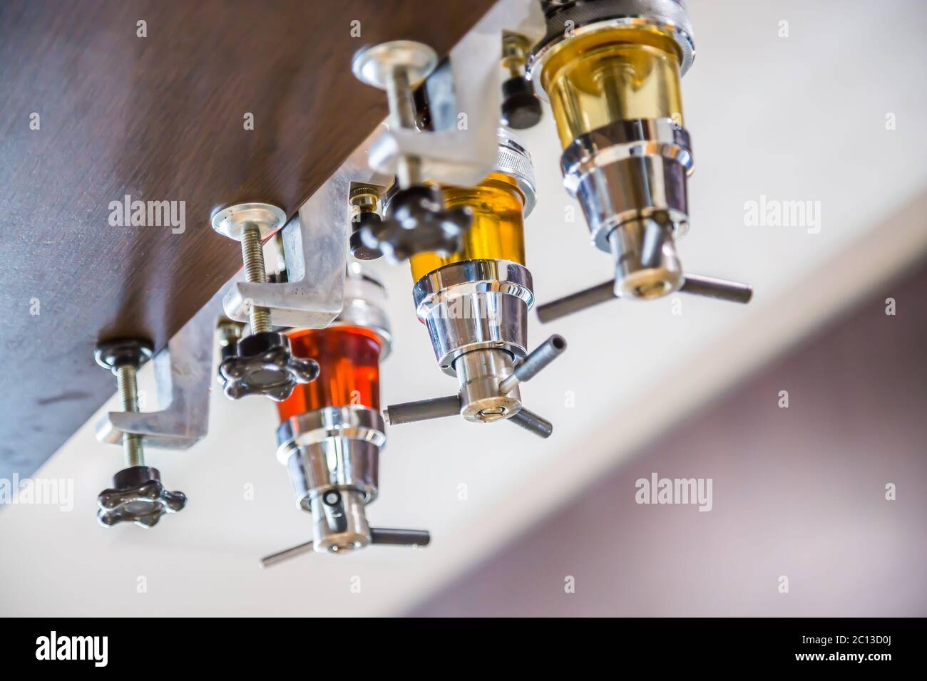 Close-up on colorful alcohol dispenser in a bar Stock Photo