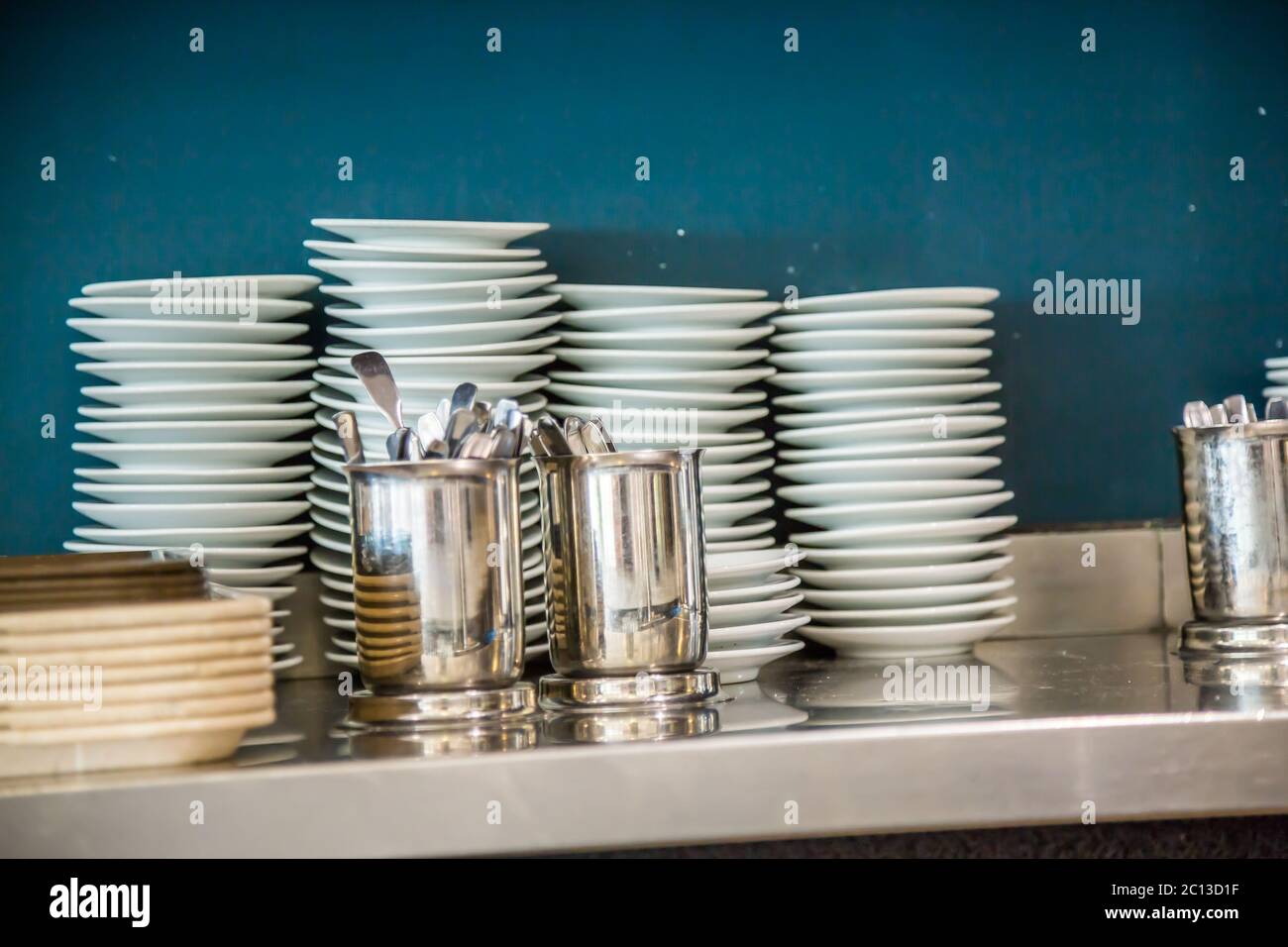 Dessert plates stacked in a restaurant Stock Photo Alamy