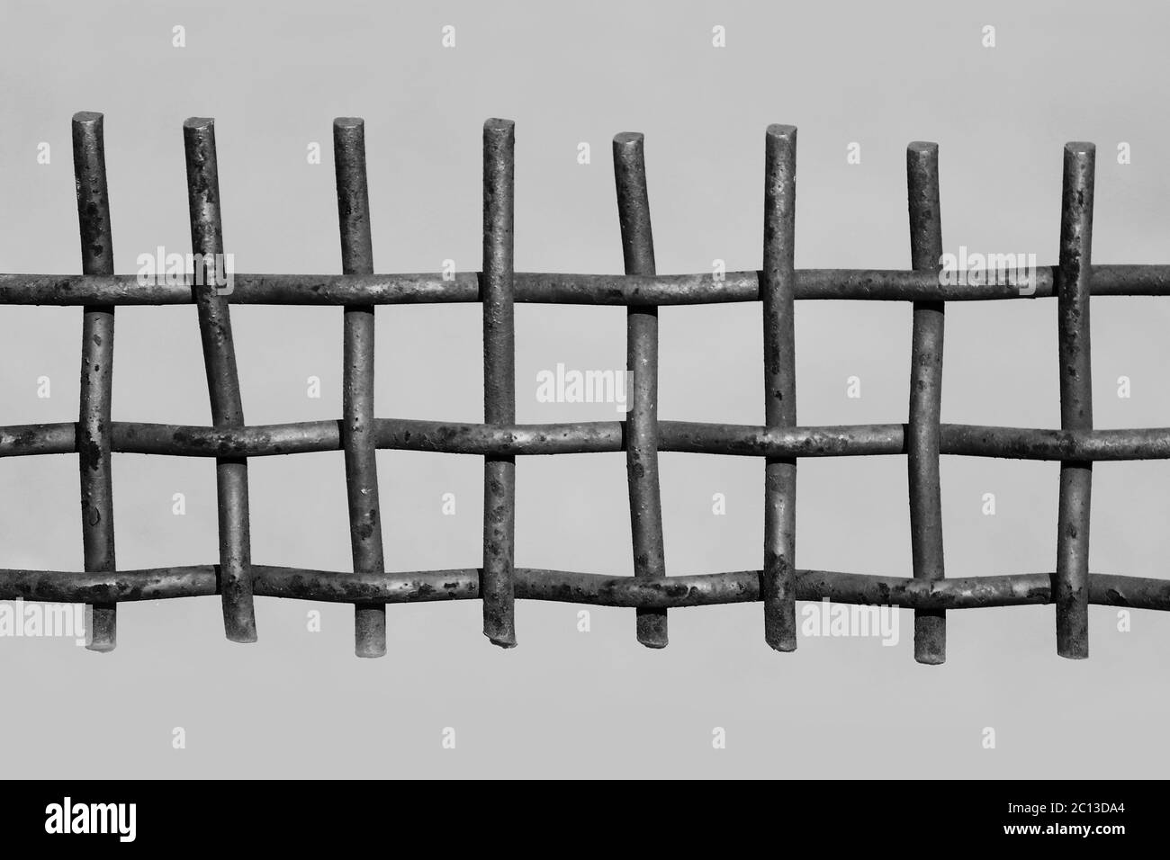 black and white photo rusty metal fence on a grey background Stock ...