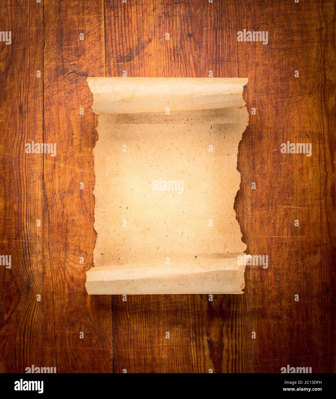 parchment scroll on wooden background Stock Photo