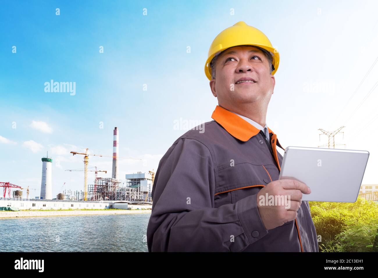 old asian man engineer with power plant Stock Photo