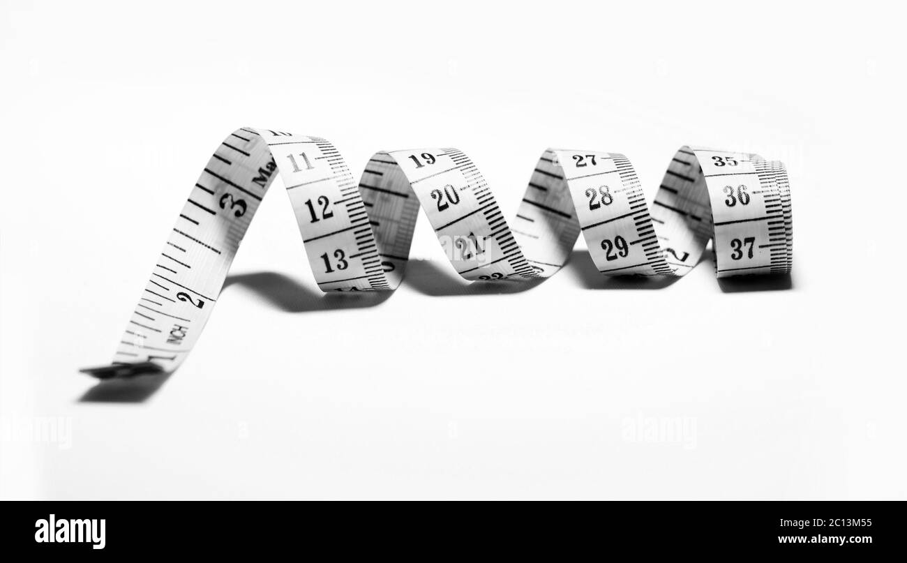 Photo of a white tape measure isolated Stock Photo - Alamy