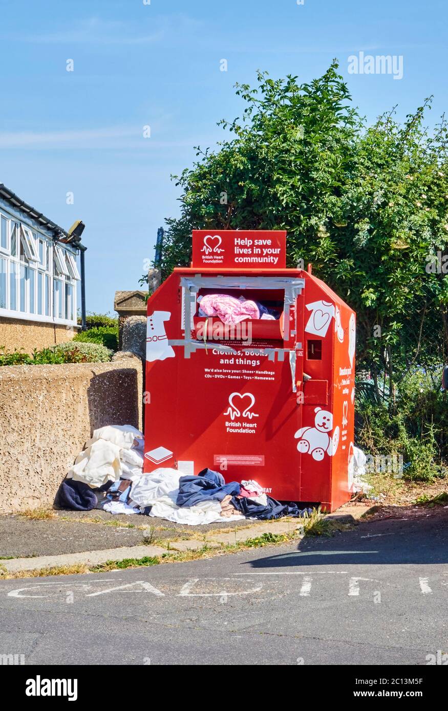 Overflowing clothes bank hires stock photography and images Alamy
