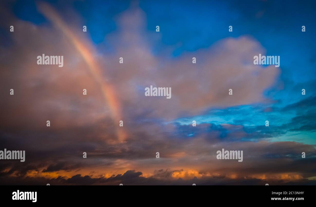 Rainbow over the ocean Stock Photo - Alamy