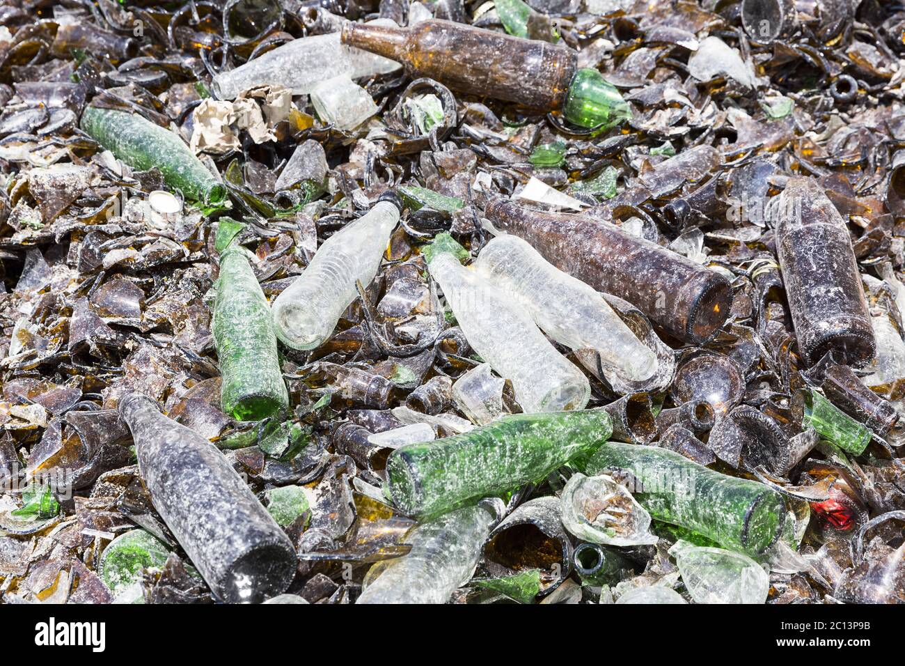 Glass waste in recycling facility. Brown and green bottles Stock Photo ...