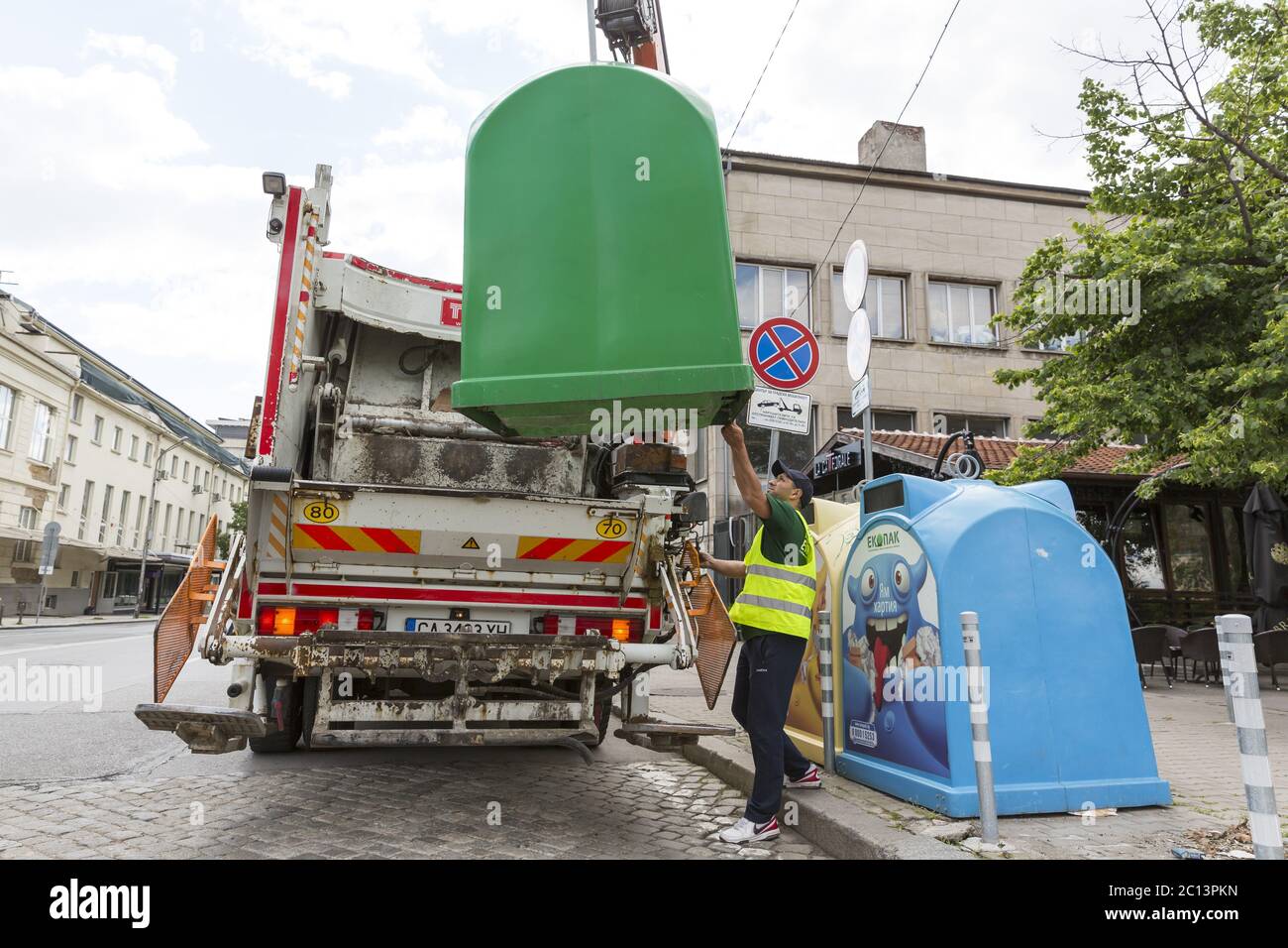 Recycling truck picking up trash bins Stock Photo Alamy