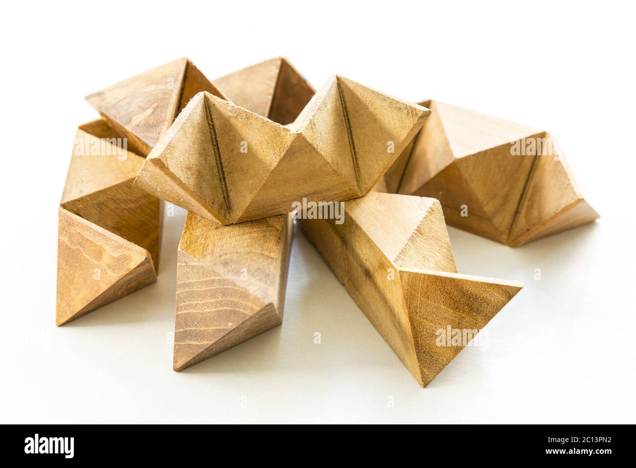 Wooden puzzle on white Stock Photo