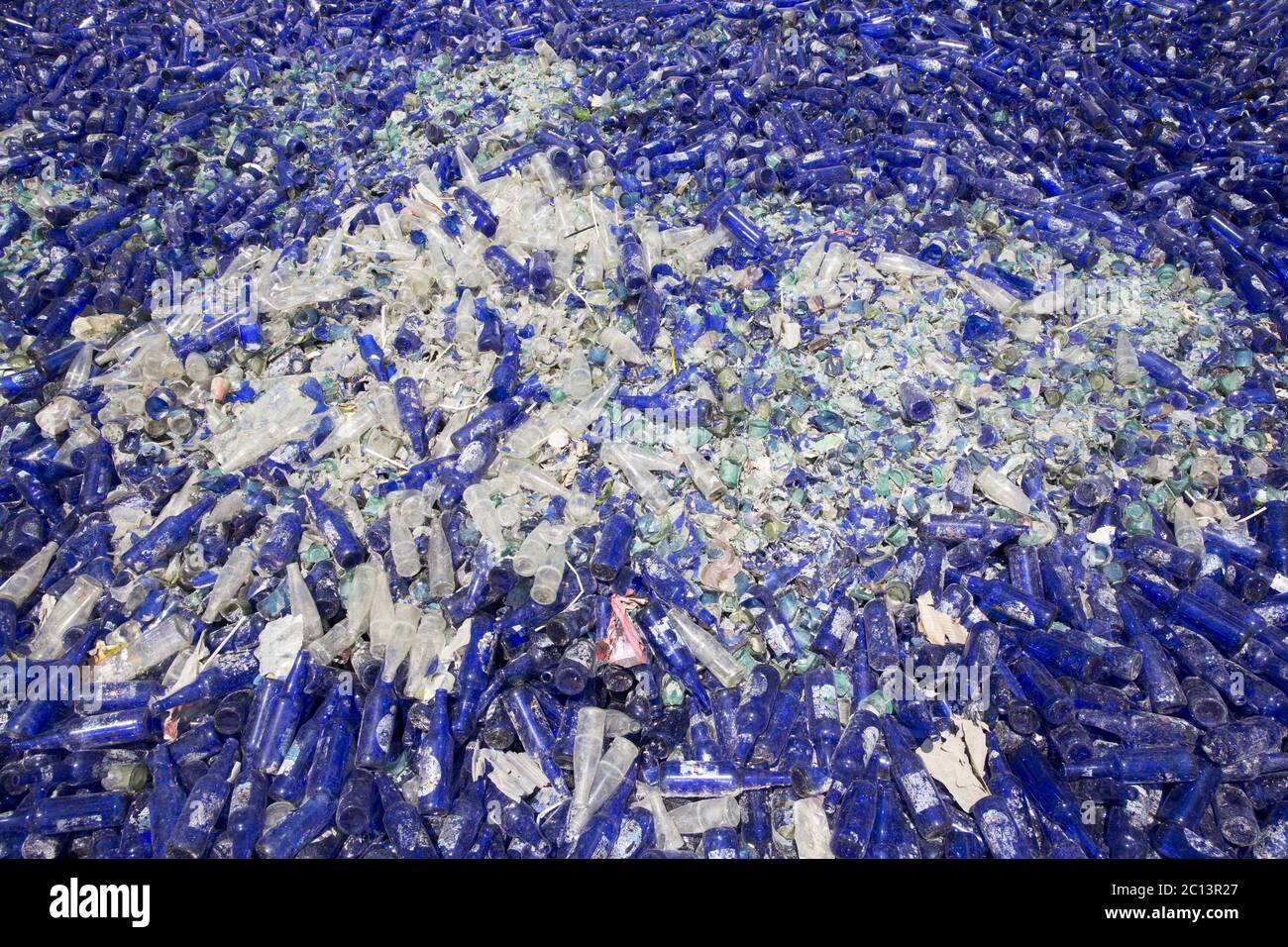 Glass waste in recycling facility. Blue bottles Stock Photo Alamy