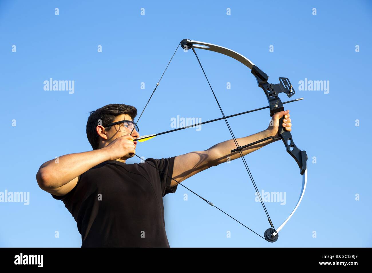 Archer Drawing His Compound Bow Blue Sky Stock Photo Alamy
