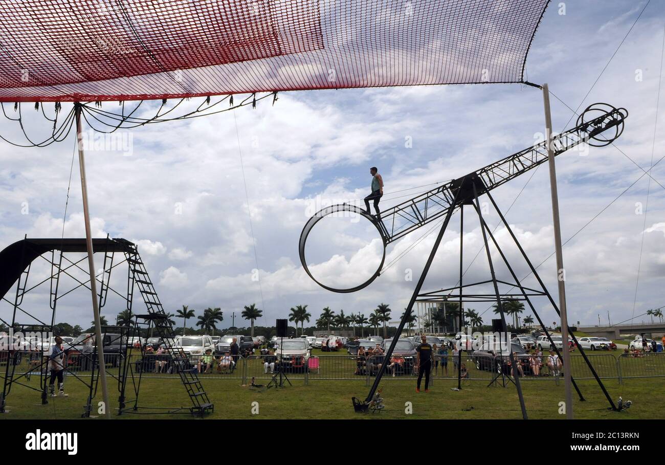 June 13, 2020 - Sarasota, Florida, United States - Tteven Dakota Delmonte performs on the wheel of death at Nik Wallenda's Daredevil Rally, billed as the world's first drive-in stunt show, on June 13, 2020 in Sarasota, Florida. The show, which runs on select dates through June 21, features internationally known daredevil performers and is designed to be a safe event during the coronavirus pandemic, with the separation of spectator's vehicles according to social distancing guidelines. (Paul Hennessy/Alamy) Stock Photo