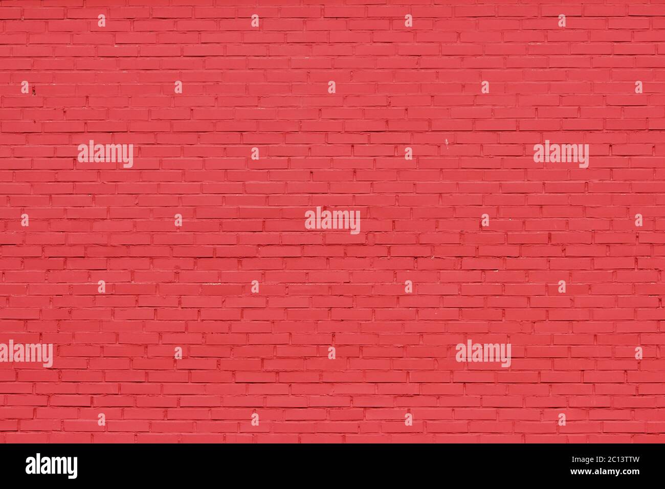 texture of bright red brick wall on a sunny day. Stock Photo