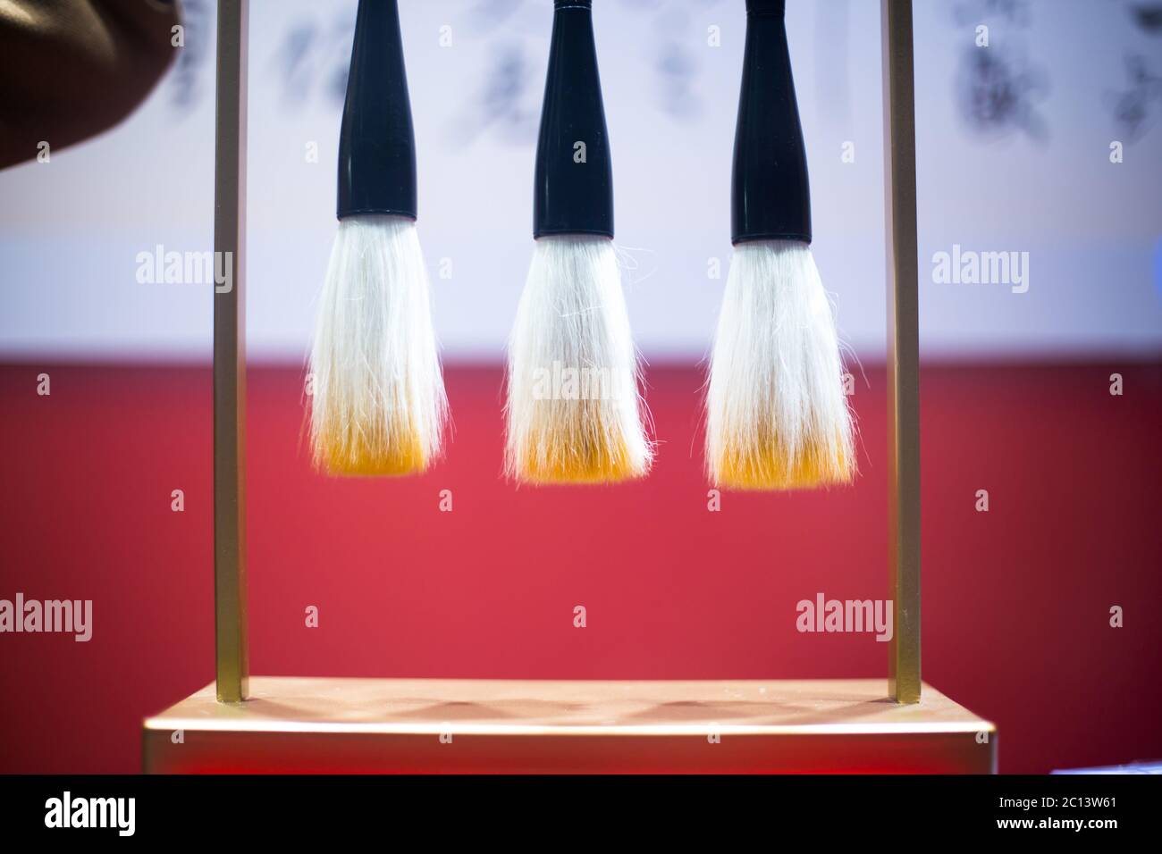 hanging calligraphy brushes on steel frame Stock Photo