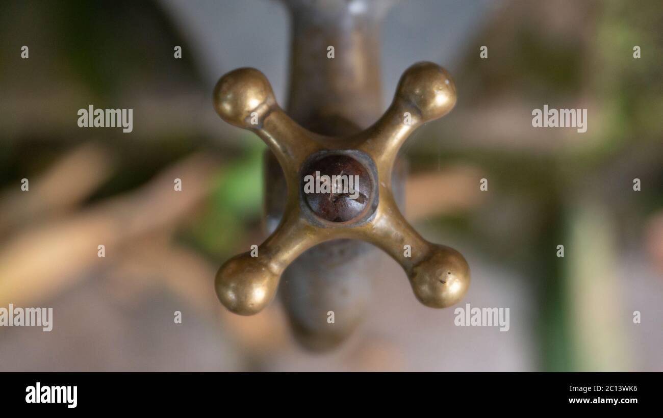 Brass water tap in a school. washing your hands with soap regularly can
