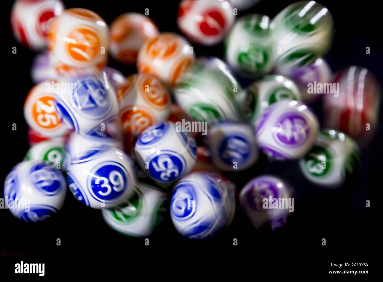 Colourful lottery balls in a machine Stock Photo Alamy