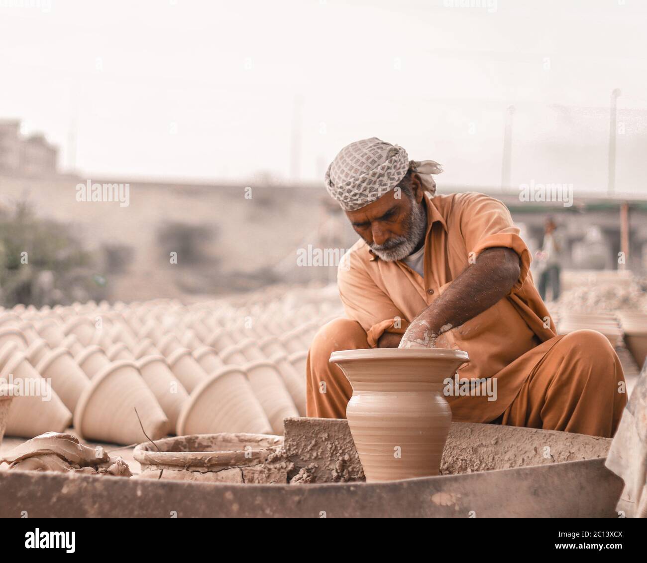 Karachi Pakistan 2018, an old man doing a pottery work at pottery wheel in morning time, handicrafts of Pakistan, art, Asia. Stock Photo