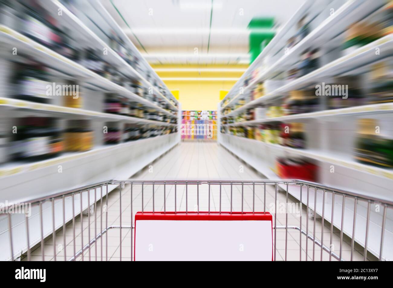 Shopping Cart View on a Supermarket Aisle and Shelves Image Has Shallow Depth of Field Stock