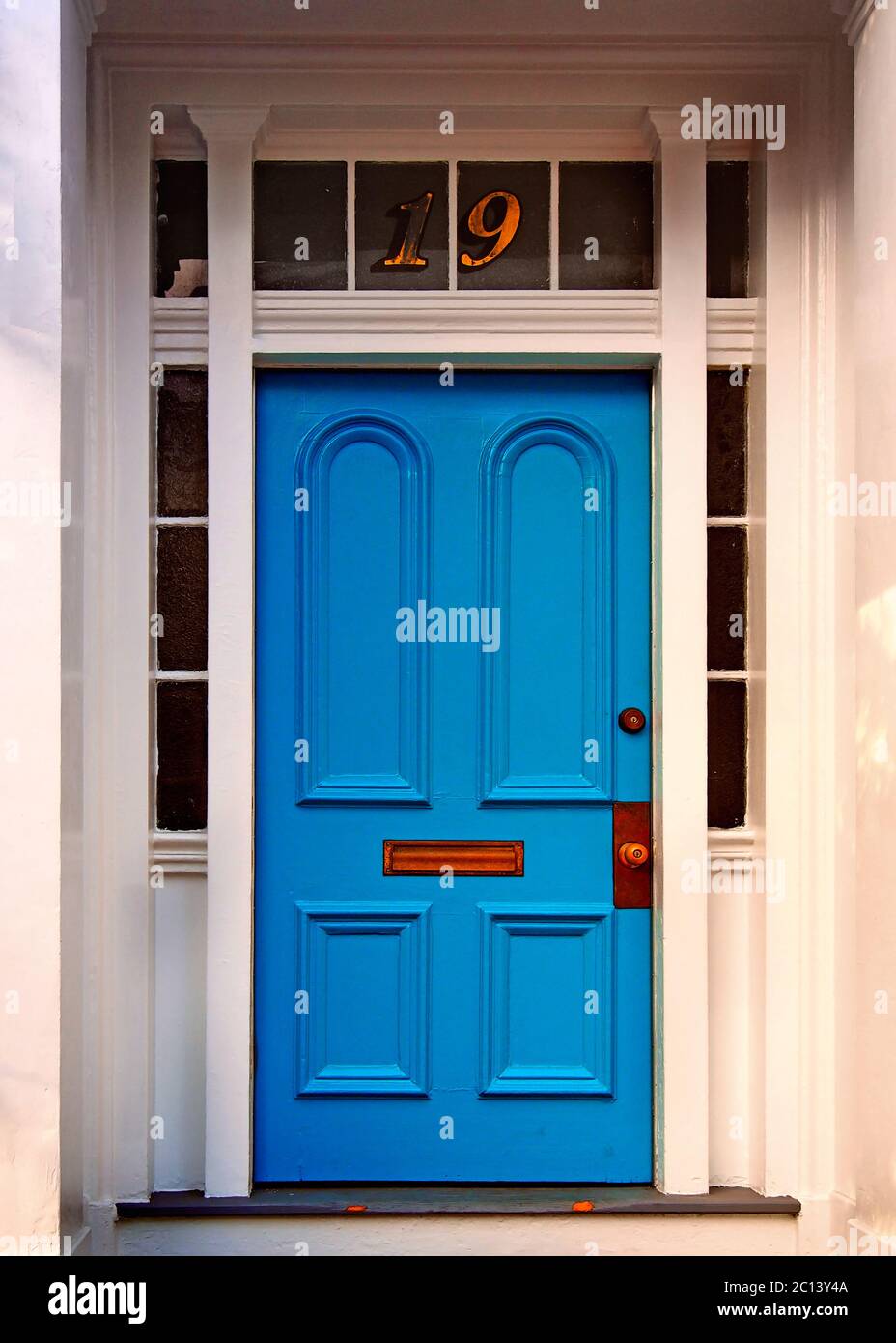 A bright blue entryway door. Stock Photo