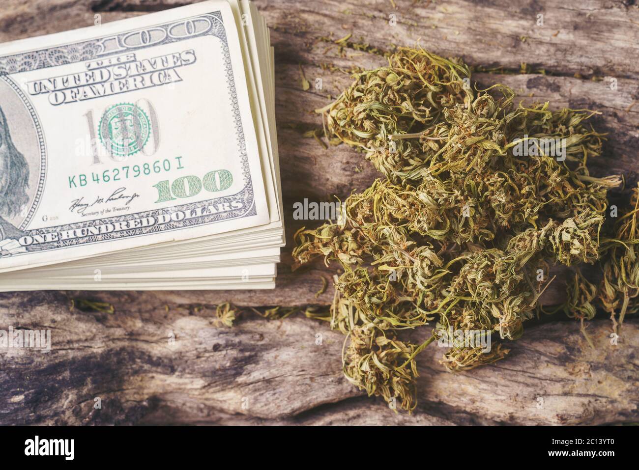 dried cannabis medical marijuana with dollar banknote Stock Photo