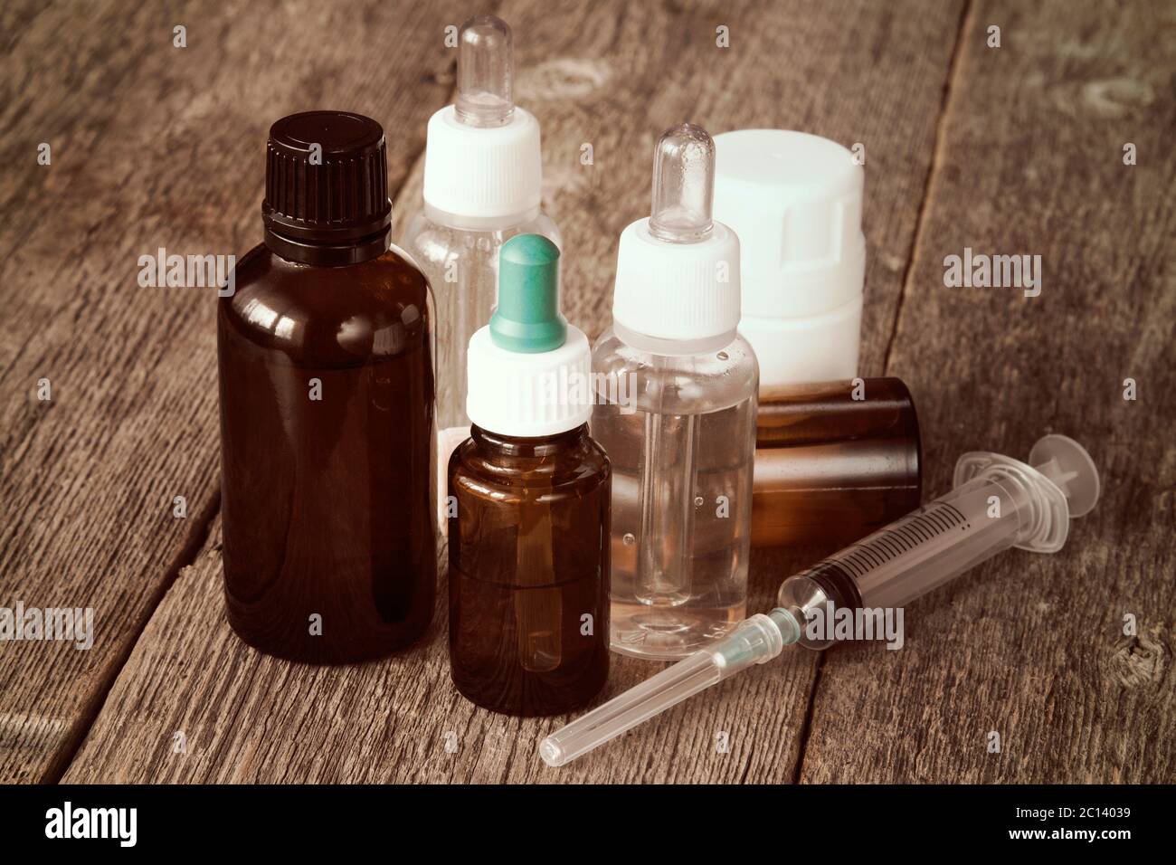 Syringe and various medicaments Stock Photo