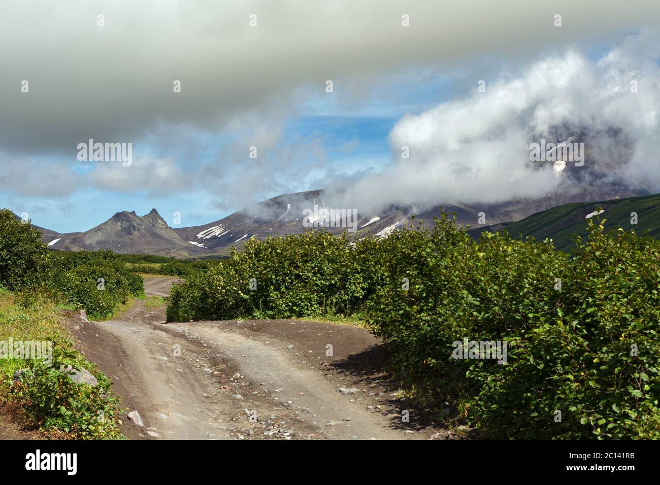 Road along dry river to Avachinskaya group Volcano on Kamchatka Peninsula Stock Photo