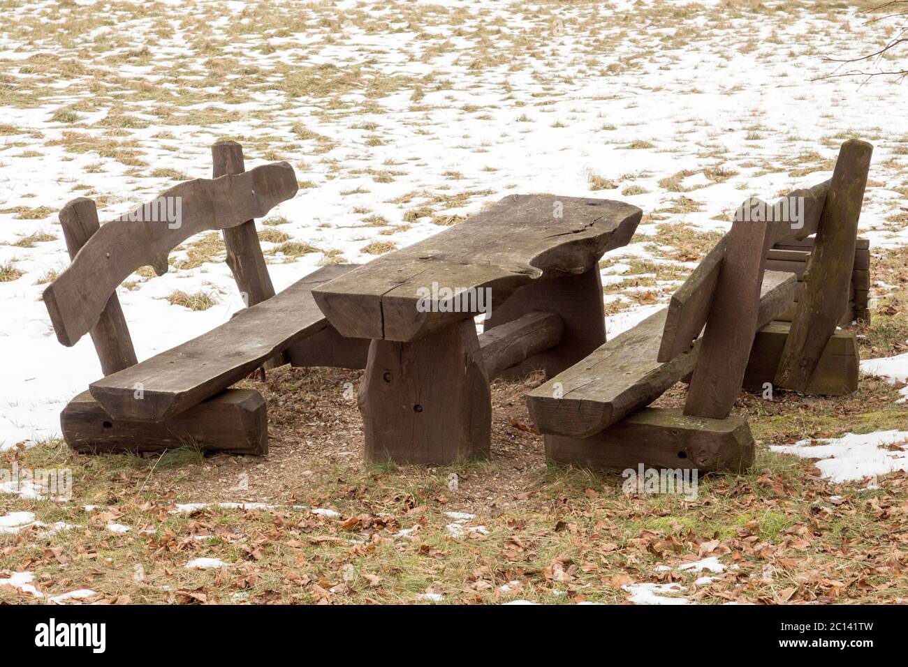 Wooden picnic table with benches Stock Photo - Alamy