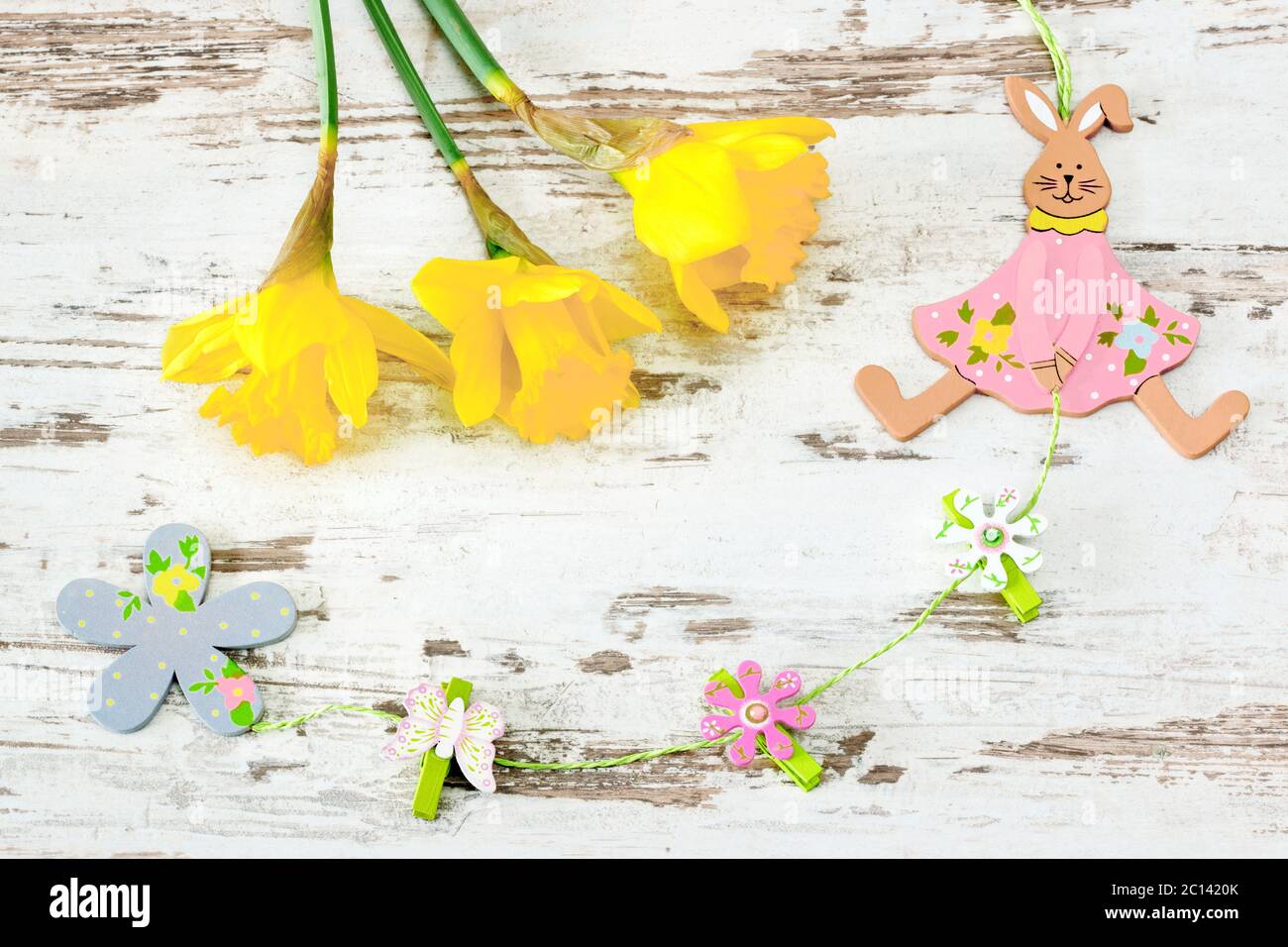 easter bunny of wood with jonquil Stock Photo