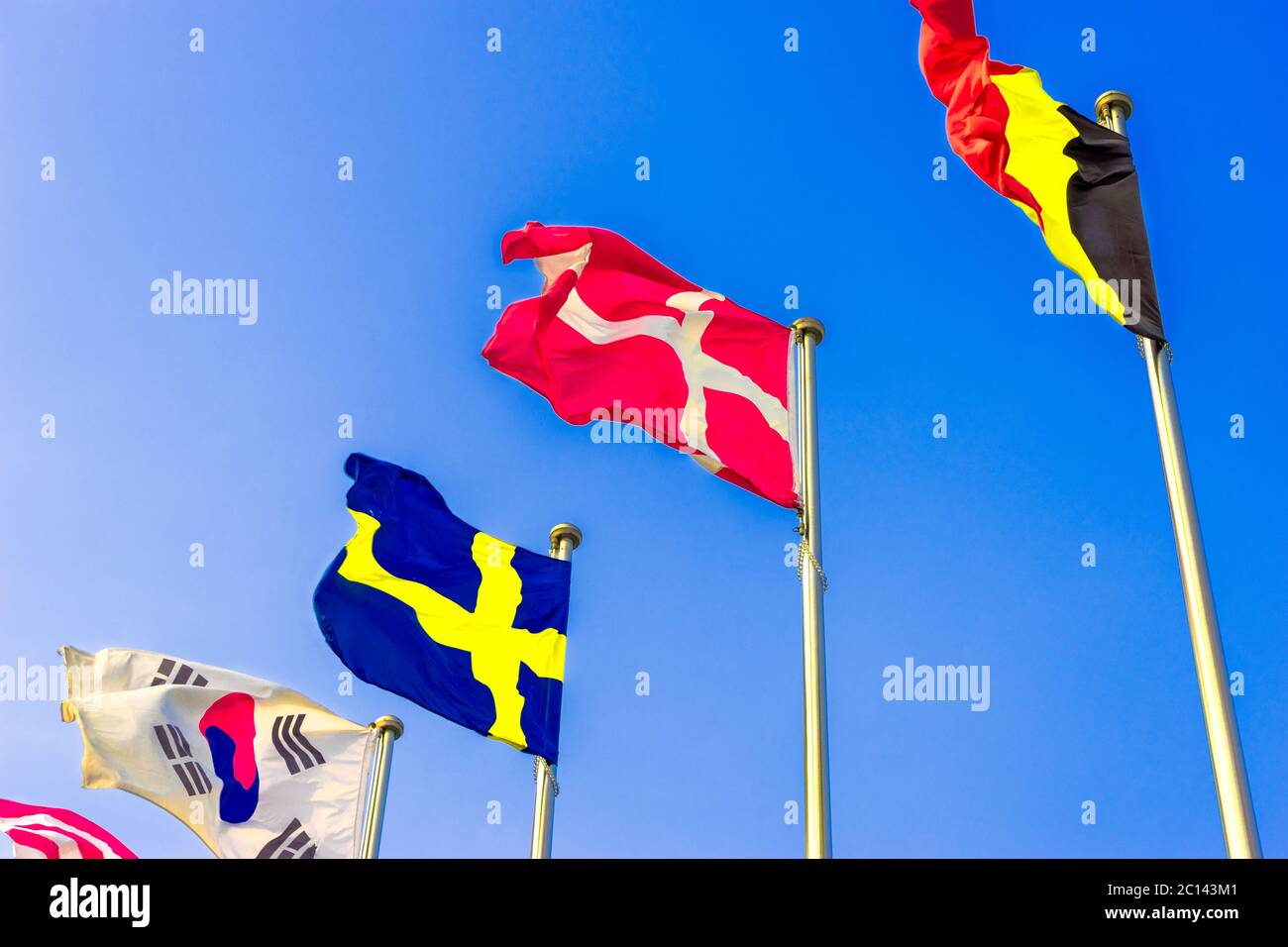 national flags flying in wind Stock Photo Alamy