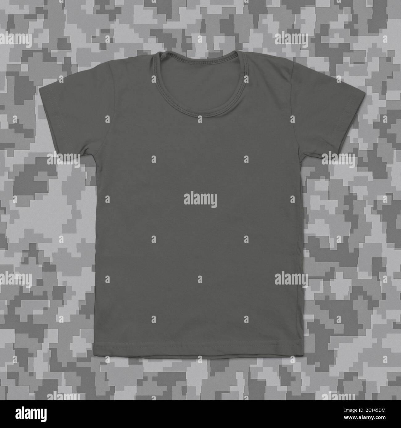 Grey blank t-shirt on camouflage background Stock Photo