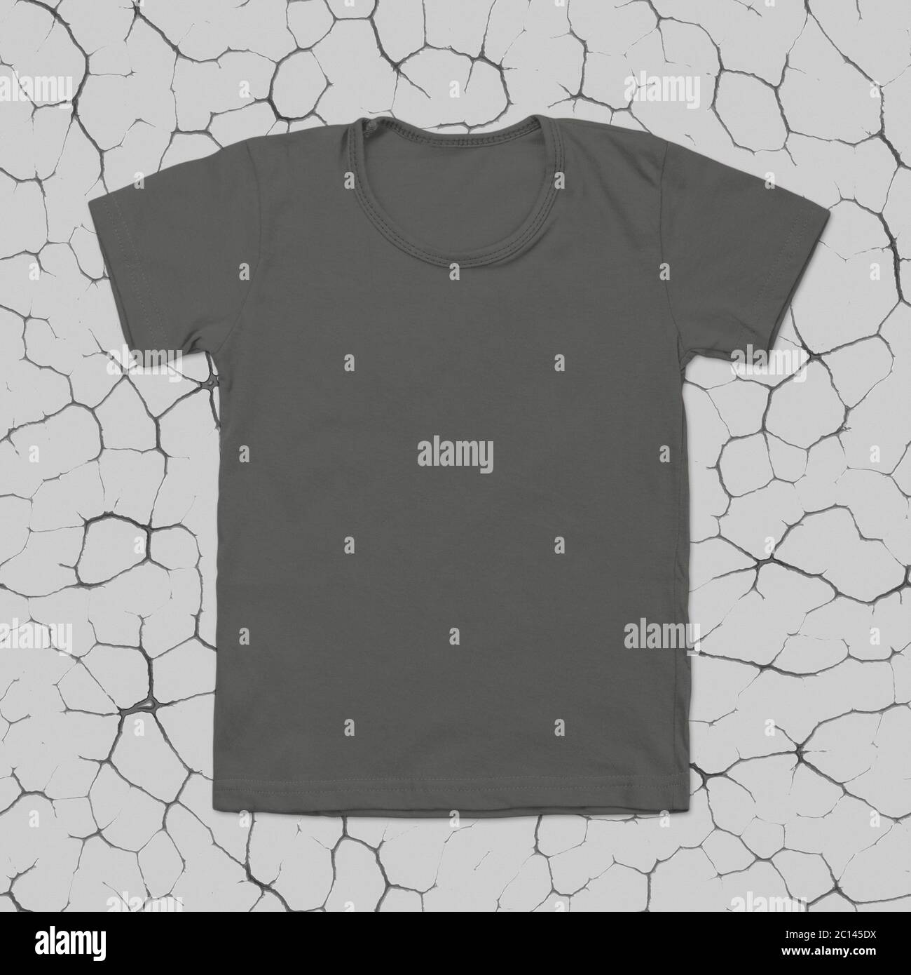 Grey blank t-shirt on dark cracked background Stock Photo - Alamy