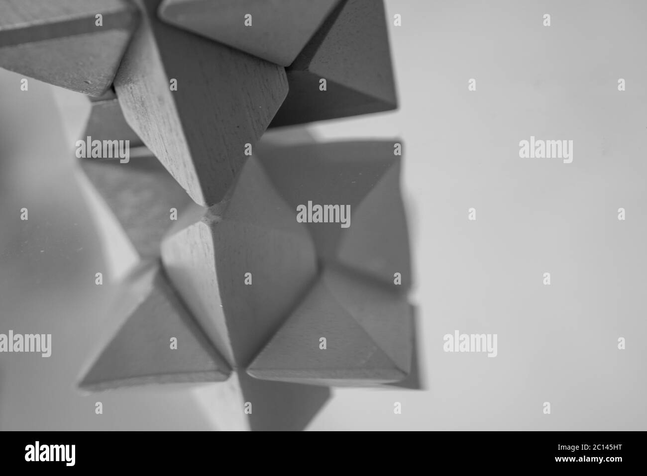 Black and white irregular block reflecting on the board. Studio shot of