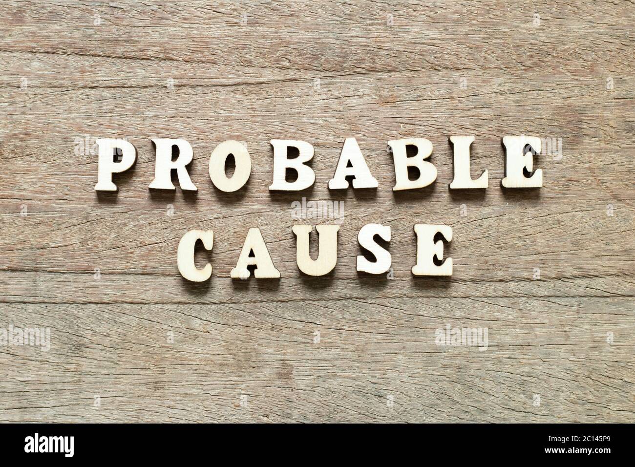 Letter block in word probable cause on wood background Stock Photo