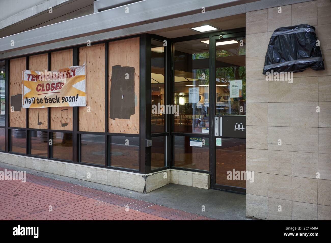 A temporarily closed and boarded up McDonald's restaurant in downtown Portland, Oregon, during the ongoing protest, seen on Saturday, Jun 13, 2020. Stock Photo