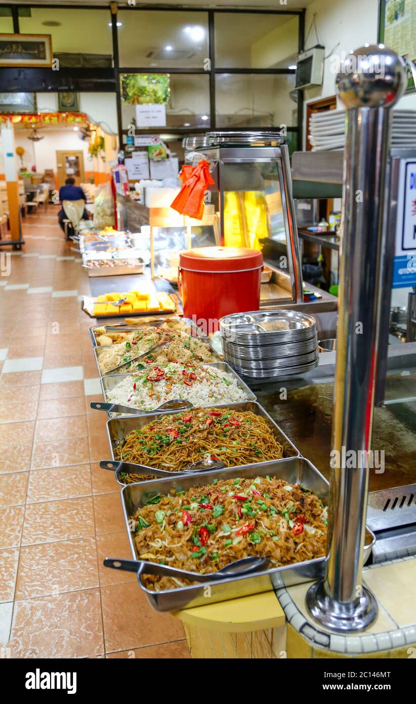 Kuala Lumpur, Malaysia - April 2017. Food laid out in restaurant for self service. Stock Photo