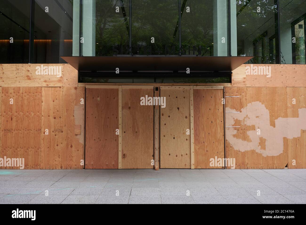 The Sixth+Main office tower in downtown Portland is seen boarded up to protect from further damage amid the ongoing protest on Saturday, Jun 13, 2020. Stock Photo