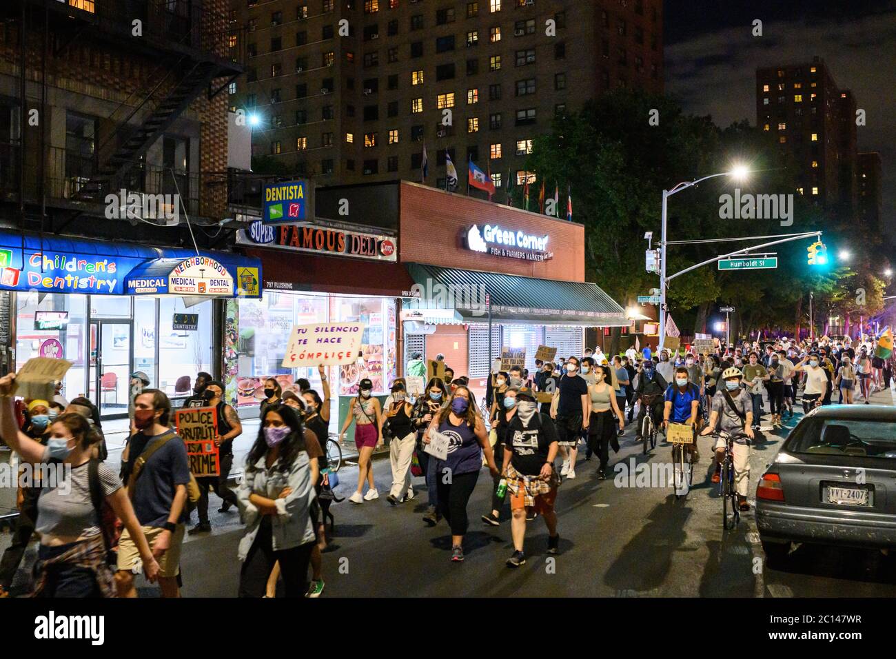 Protestors in Bushwick, Brooklyn marching to protest recent police shootings throughout the US. Stock Photo