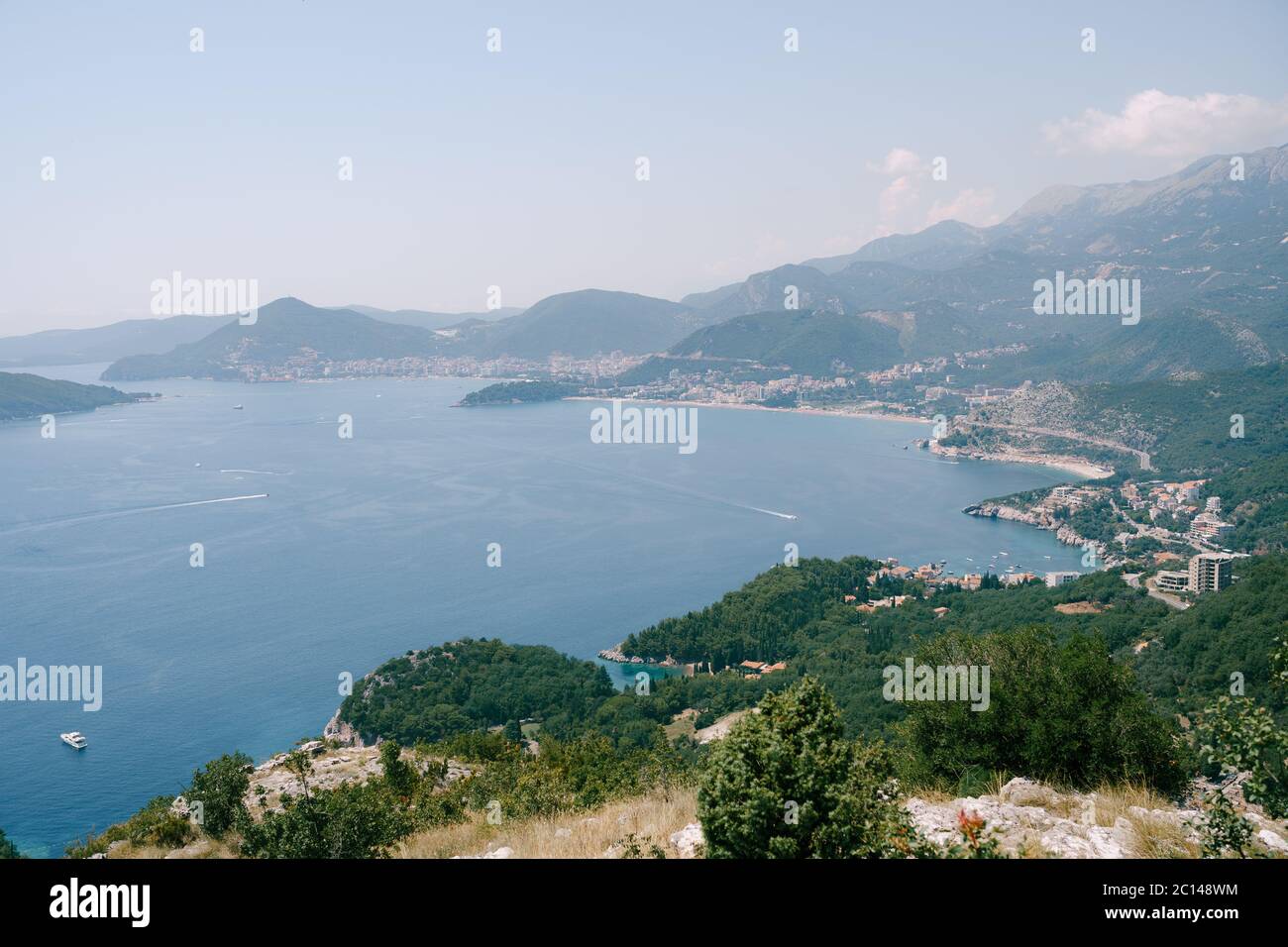 The road along the coast on the Adriatic coast in Montenegro, through the cities - Przno, Kamenovo, Rafailovici, Becici, Budva. Stock Photo