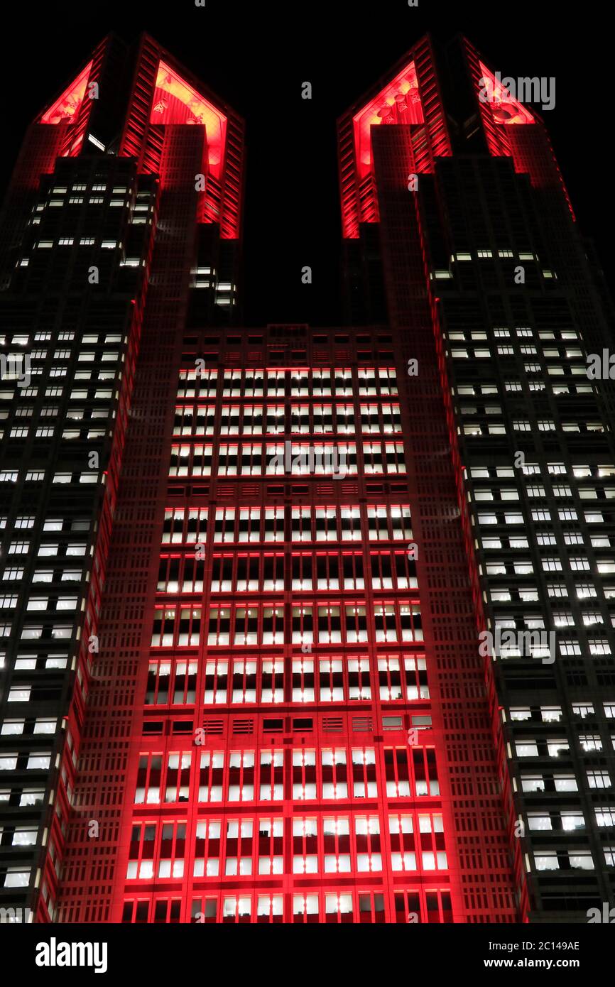 Tokyo metropolitan government building is lit up in red signifying “Tokyo alert” warning an additional caution against COVID-19 infections on 10 June. Stock Photo