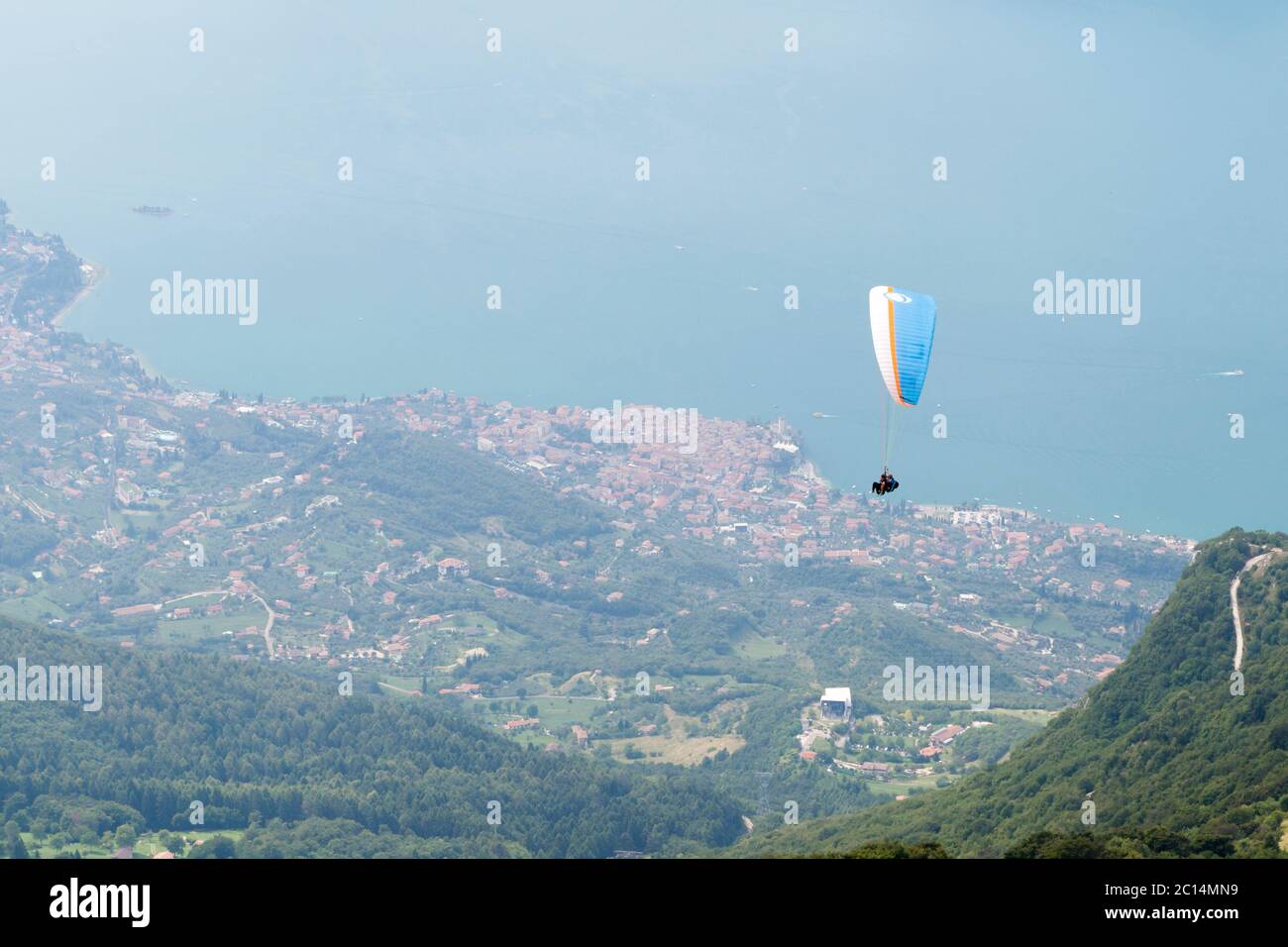 Paragliders descending from monte Baldo, Lake Garda, Italy Stock Photo