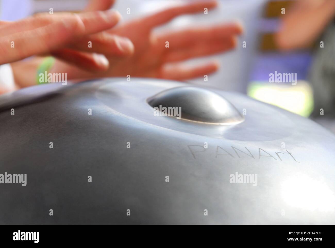 hands play on a PANArt Hang music instrument Stock Photo Alamy