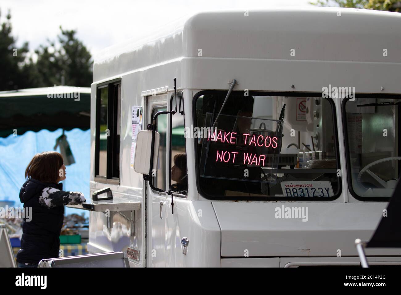 London, UK. 14th June, 2020. Stallholders set up shop in Chiswick at the return of the Sunday food market. Proceeds from the first month are being donated to Chiswick School’s Breakfast Club. Credit: Liam Asman/Alamy Live News Stock Photo