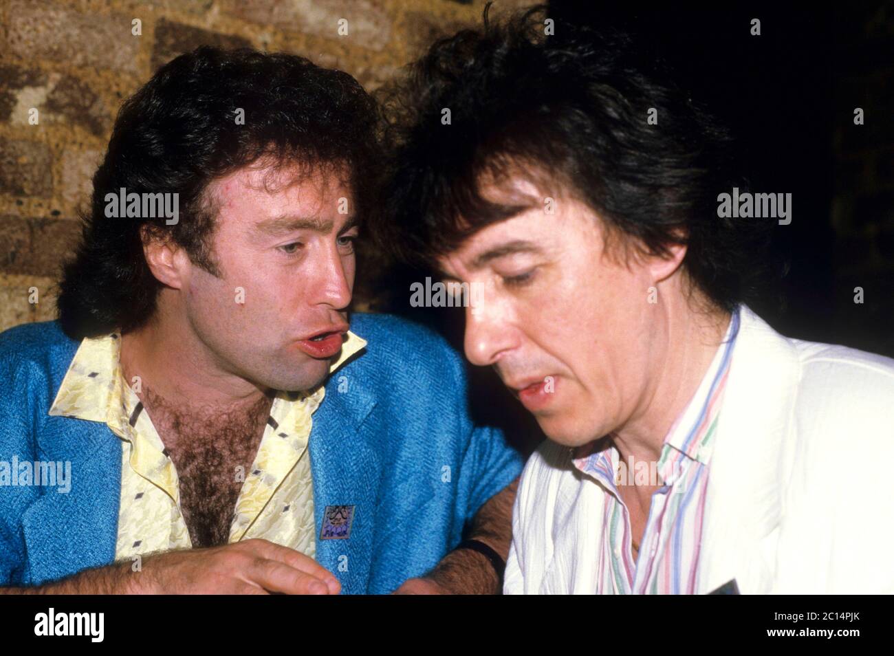 Paul Rodgers and Bill Wyman of Willie and the Poor Boys at a press meeting. London, April 18, 1985 | usage worldwide Stock Photo