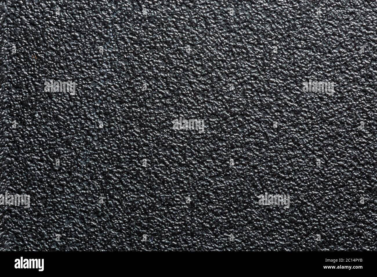 flat black rugged plastic or rubber surface with decorative bumpy