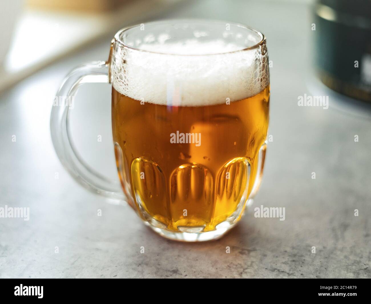 Glass of home made beer on table. Beer during quarantine. Stop Coronavirus Stock Photo