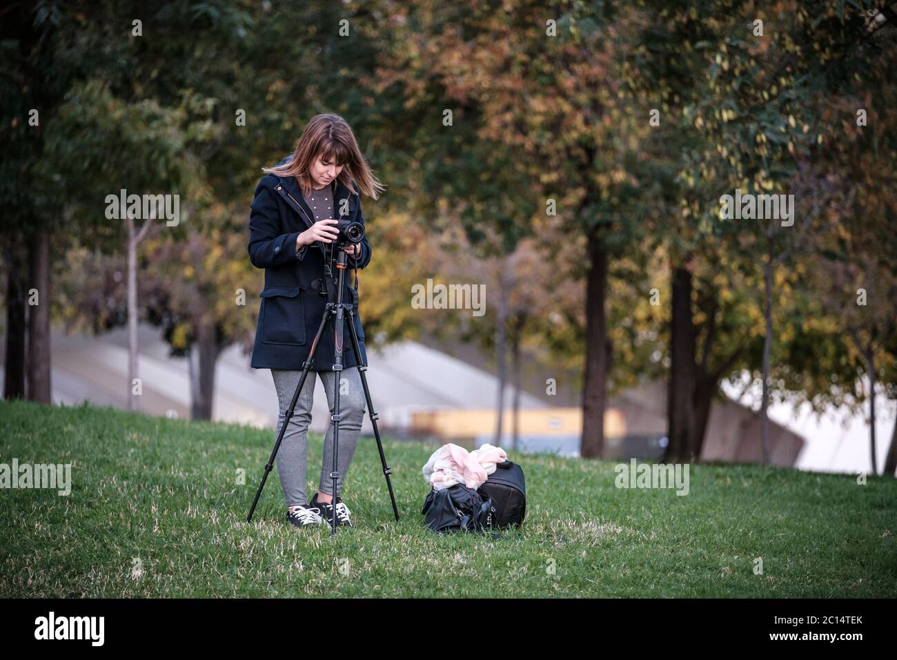 woman traveler landscape photography with mirrorless camera travel night photo with tripod to avoid shake Stock Photo