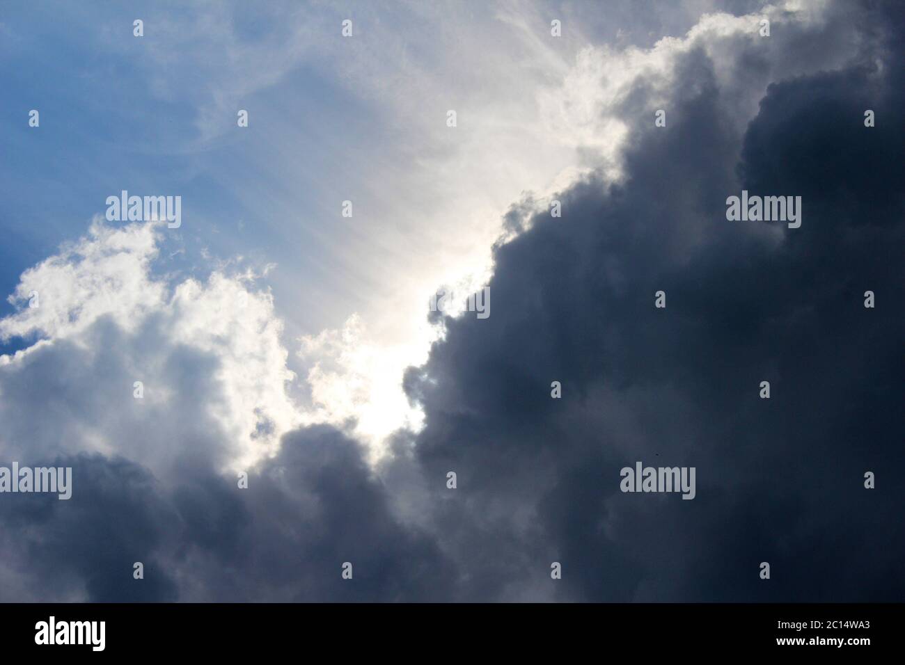 Contrasting black and white clouds next to each other over Manchester, England Stock Photo