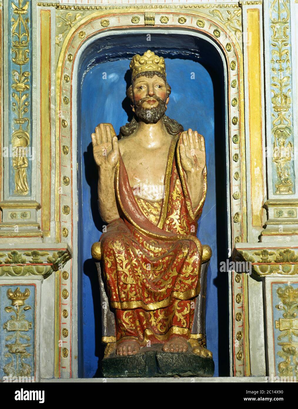 Gothic image of the Savior showing his sores. It dates from the 14th century and was Integrated in the 1532 polychrome stone altarpiece, work of Juan de Alava. Chapel of The Savior formerly called Chapel of the king of France. Cathedral of Santiago de Compostela, Galicia, Spain. Stock Photo