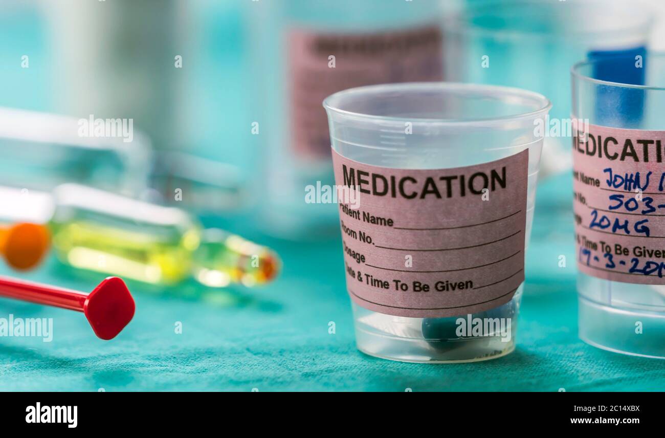 Diverse medication in glasses monodose along with insulin injectors in ...