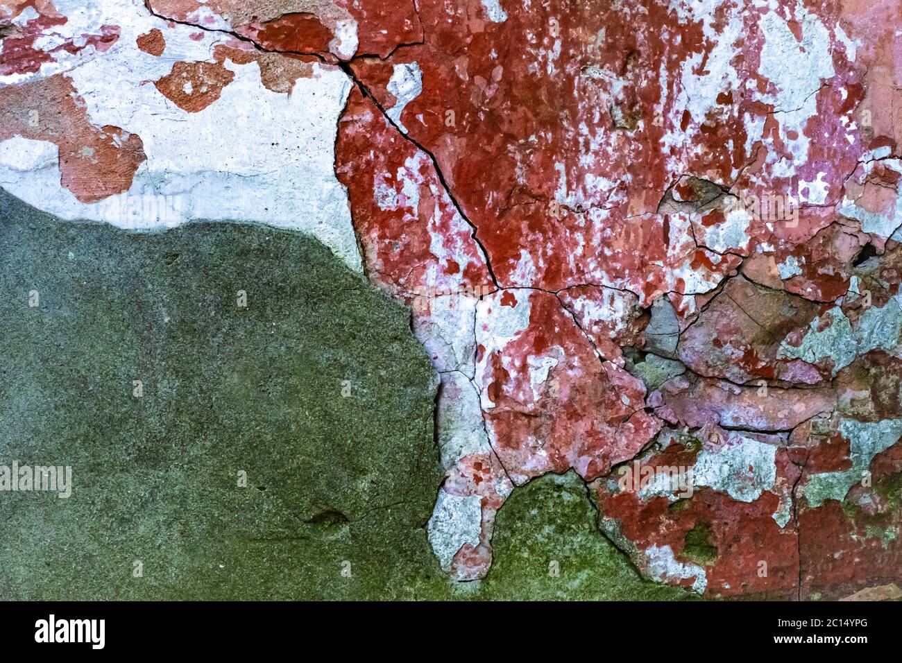 Decayed old white wall with red bricks, background Stock Photo