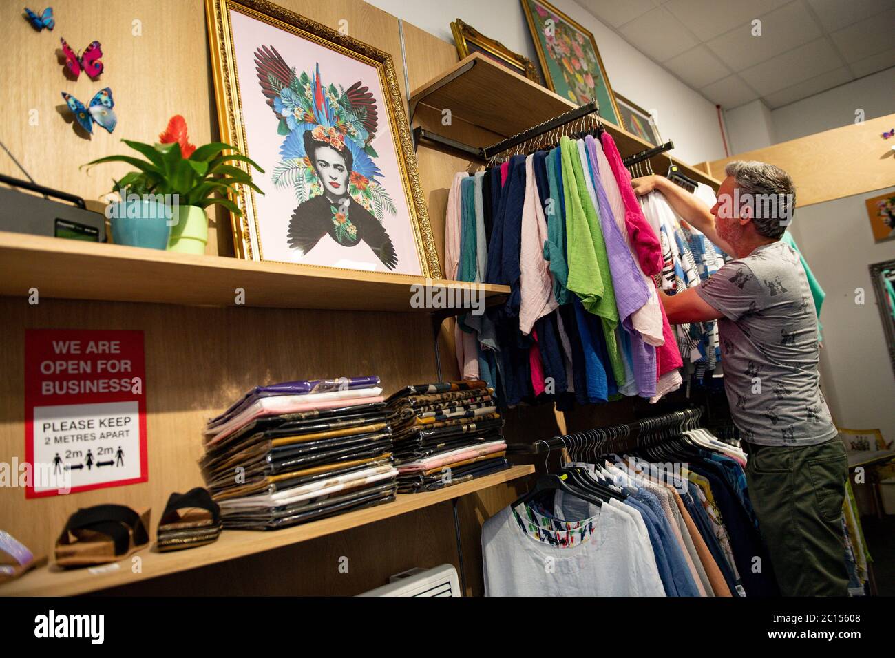 Retailer Clive Williams prepares his fashion store Pop Up Clothing Company  for customers in Stratford-upon-Avon, Warwickshire, ahead of the re-opening  of non-essential retailers in England on June 15 Stock Photo - Alamy