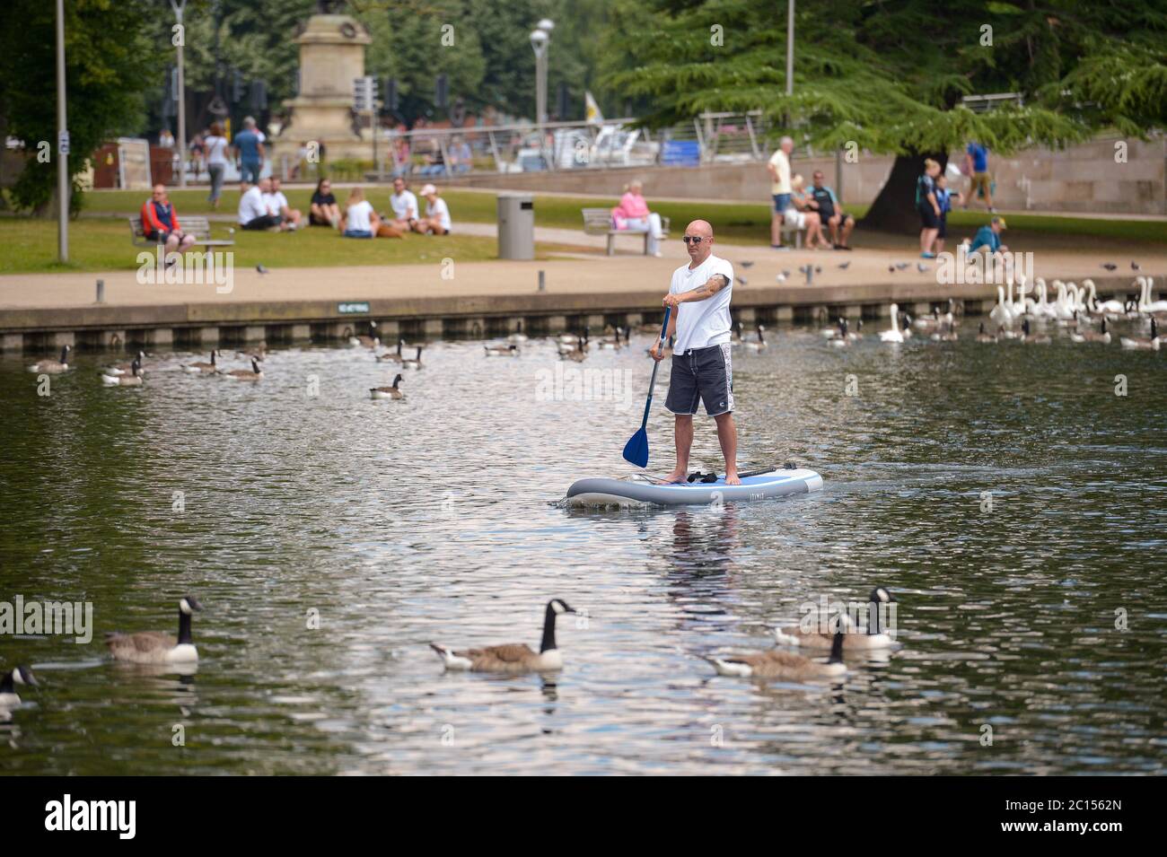 A man paddle boarding on the River Avon in StratforduponAvon